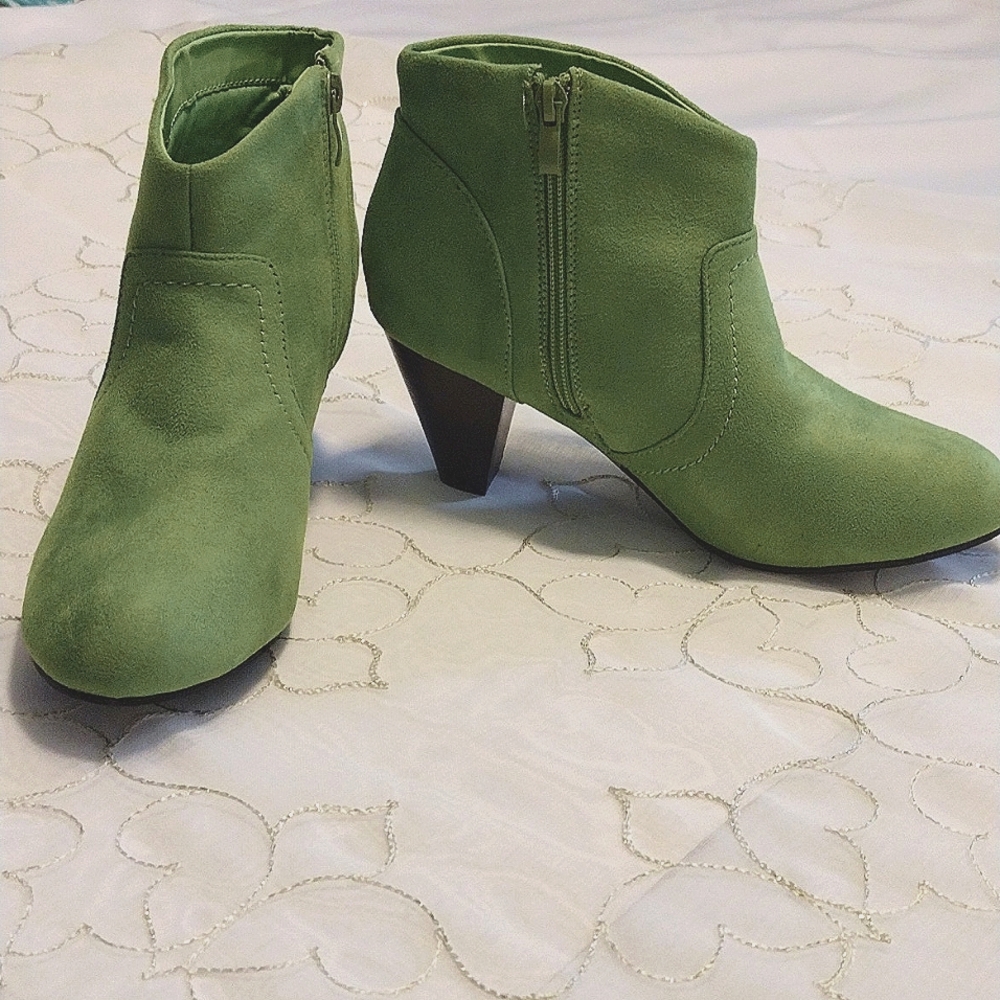Green colored ankle booties by  Boston design studio